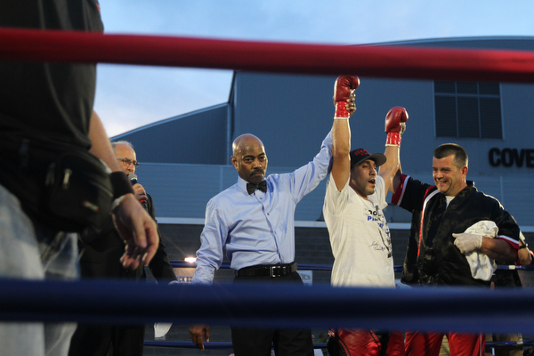 Nikos Frazier | The Vindicator..Jake "The Bull" Giuriceo(center) is announced the winner at the South Side Boxing Club Championship Night at the Covelli Center.