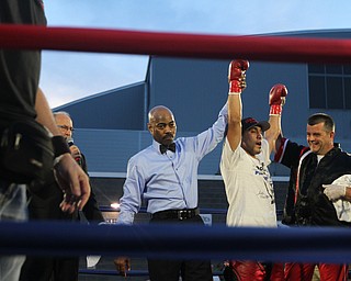 Nikos Frazier | The Vindicator..Jake "The Bull" Giuriceo(center) is announced the winner at the South Side Boxing Club Championship Night at the Covelli Center.