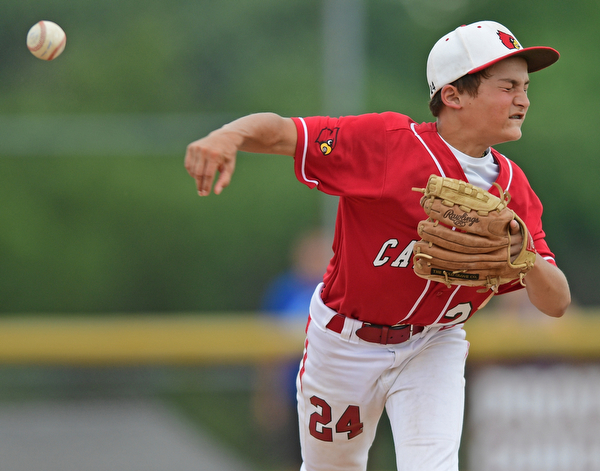 BOARDMAN, OHIO - JULY 24, 2016: Second baseman Drew Carroce #24 of Canfield throws first in a unsuccessful attempt to throw out Cayden Evans #1 of Hamilton in the fifth inning of Sunday afternoons Little League State Championship Game at the Fields of Dreams. Hamilton won 11-0. DAVID DERMER | THE VINDICATOR