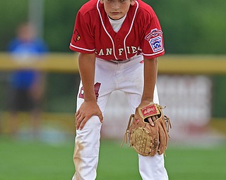 BOARDMAN, OHIO - JULY 24, 2016: Second baseman Drew Carroce #24 of Canfield shows his frustration after a unsuccessful attempt to throw out Cayden Evans #1 of Hamilton in the fifth inning of Sunday afternoons Little League State Championship Game at the Fields of Dreams. Hamilton won 11-0. DAVID DERMER | THE VINDICATOR
