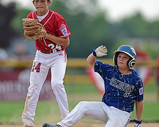 BOARDMAN, OHIO - JULY 24, 2016: Second baseman Drew Carroce #24 of Canfield keeps his foot on the bag to force out Matthew Goll #5 of Hamilton in the sixth inning of Sunday afternoons Little League State Championship Game at the Fields of Dreams. Hamilton won 11-0. DAVID DERMER | THE VINDICATOR