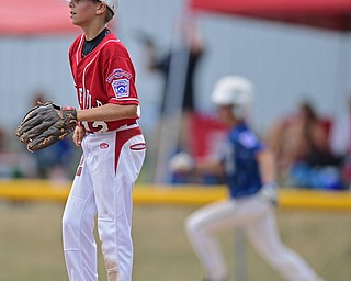 BOARDMAN, OHIO - JULY 24, 2016: Relief pitcher Ryan Petro #12 of Canfield shows his frustration after a two RBI double by  Curtus Moak #6 of Hamilton in the sixth inning of Sunday afternoons Little League State Championship Game at the Fields of Dreams. Hamilton won 11-0. DAVID DERMER | THE VINDICATOR