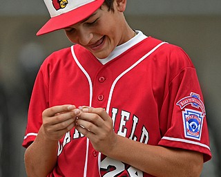 BOARDMAN, OHIO - JULY 24, 2016: Second baseman Drew Carroce #24 of Canfield smiles after receiving his state runner up pin after Sunday afternoons Little League State Championship Game at the Fields of Dreams. Hamilton won 11-0. DAVID DERMER | THE VINDICATOR