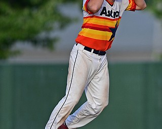 STRUTHERS, OHIO - JULY 24, 2016: Zachary Senchak #5 of Astro holds his head in disbelief after driving in the game winning run with a single in the seventh inning of their NABF Championship game Sunday night at Cene Park. Astro won 5-4. DAVID DERMER | THE VINDICATOR