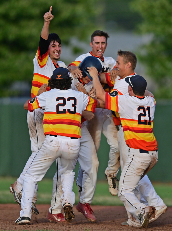 STRUTHERS, OHIO - JULY 24, 2016: Zachary Senchak #5 of Astro is mobbed by his teammates Matt Gibson #24, Jared Kapturasky #8, XXX, Richie Serignese #23 and Tyler Canova #21 after driving in the game winning run with a single in the seventh inning of their NABF Championship game Sunday night at Cene Park. Astro won 5-4. DAVID DERMER | THE VINDICATOR..There are two #9's on the roster sheet. Hank Clegg and Dylan Speicher.
