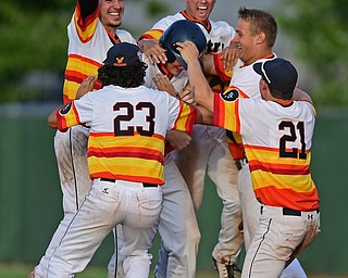 STRUTHERS, OHIO - JULY 24, 2016: Zachary Senchak #5 of Astro is mobbed by his teammates Matt Gibson #24, Jared Kapturasky #8, XXX, Richie Serignese #23 and Tyler Canova #21 after driving in the game winning run with a single in the seventh inning of their NABF Championship game Sunday night at Cene Park. Astro won 5-4. DAVID DERMER | THE VINDICATOR..There are two #9's on the roster sheet. Hank Clegg and Dylan Speicher.