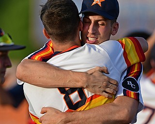 STRUTHERS, OHIO - JULY 24, 2016: Jacob Bonner #11 of Astro hugs teammate Jared Kapturasky #8 after the dramatic ending of the NABF Championship game Sunday night at Cene Park. Astro won 5-4. DAVID DERMER | THE VINDICATOR