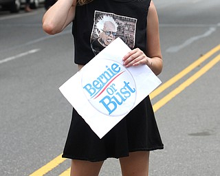 Nikos Frazier | The Vindicator..Erica Dempsey, of Brooklyn, NY., holds a "Bernie of Bust" sign while walking with other Sen. Bernie Sanders supporters down Broad St. towards the Wells Fargo Center on the first day of the Democratic National Convention in Philadelphia.