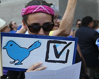 Nikos Frazier | The Vindicator..Natasha Finnegan, of Maryland, holds a "Berdie" sign outside of Philadelphia's City Hall on the first day of the Democratic National Convention.