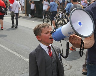 Nikos Frazier | The Vindicator..Connor Garrett, 9, of Camden, Conn. shouts "Black Lives Matter" into a microphone while marching with his father and Sen. Bernie Sanders supporters on the first day of the Democratic National Convention in Philadelphia.