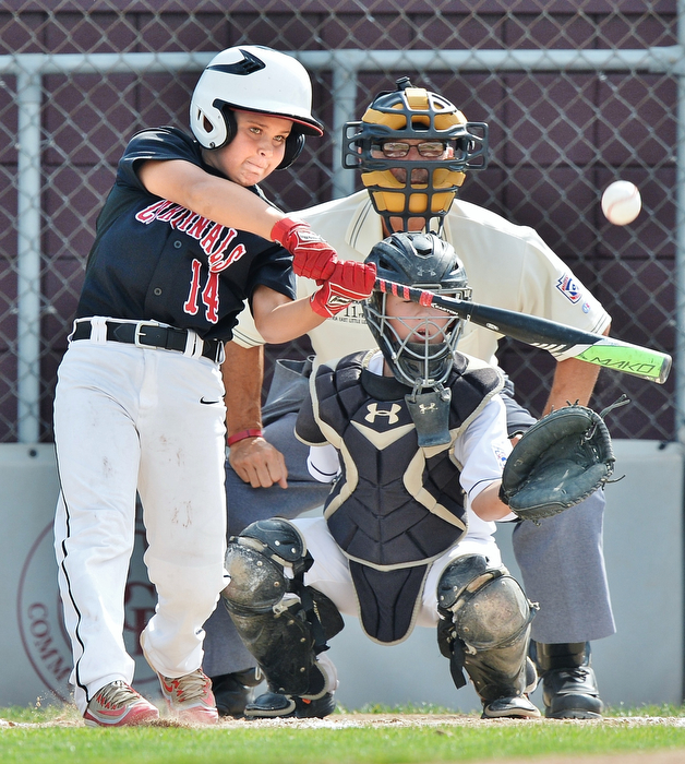 Jeff Lange | The Vindicator  MON, JUL 25, 2016 - Canfield's Ben Slanker (14) makes contact with a pitch for a two run homer in the first inning to make the score 2-0 over Washington Court House at Fields of Dreams in Boardman Monday evening. Canfield went on to win 13-1.