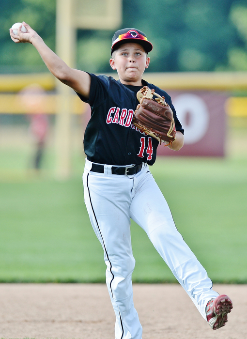 Jeff Lange | The Vindicator  MON, JUL 25, 2016 - Canfield shortstop Ben Slanker makes a hopping throw to first for an out in the bottom of the first inning of Monday's game against Washington Court House at Fields of Dreams in Boardman.