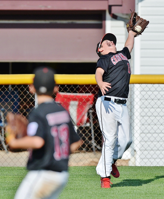 Jeff Lange | The Vindicator  MON, JUL 25, 2016 - Canfield right fielder Connor Miller (right) fails to catch a fly ball sent deep in the bottom of the third inning of Monday's game in Boardman against Washington Court House.