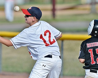 Jeff Lange | The Vindicator  MON, JUL 25, 2016 - Washington Court House first baseman Drew Guthrie (12) fails to catch a throw as Canfield's Luca Ricchiuti steps safely on the bag in the fourth inning of Monday's game in Boardman.