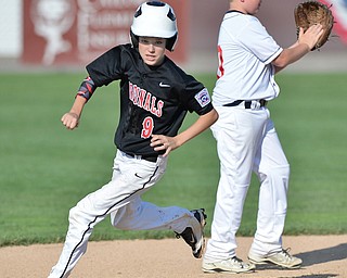 Jeff Lange | The Vindicator  MON, JUL 25, 2016 - Canfield's Jameson Beck (9) sprints to third in the top of the fourth inning of Monday's game against Washinton Court House in Boardman.