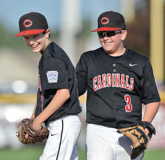 Jeff Lange | The Vindicator  MON, JUL 25, 2016 - Canfield's closer Jameson Beck (left) and first baseman AJ Havrilla share a moment of joy before the start of the bottom of the fourth inning against Washington Court House at Fields of Dreams on Monday.