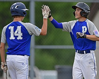 BOARDMAN, OHIO - JULY 26, 2016: Andrew Parker(0) of Poland is congratulated by teammate Bailey Swogger(14) after he scored on a bases loaded walk in the second inning of their game Tuesday afternoon at the Fields of Dreams. Poland would go on to win 10-7. DAVID DERMER | THE VINDICATOR