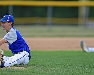 BOARDMAN, OHIO - JULY 26, 2016: Starting pitcher Stephen Carney(11) of Poland and third basemen D.J. Skarote(6) stretch on the infield during a delay due to a protest of a rules interpretation in the third inning of their game Tuesday afternoon at the Fields of Dreams. Poland would go on to win 10-7.  DAVID DERMER | THE VINDICATOR