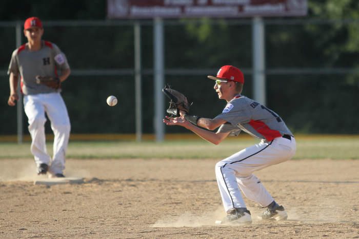 Nikos Frazier | The Vindicator..East Holmes' Patt Miller(17) opens his mitt in the second inning of the Junior Little League State Championship game at the Fields of Dreams in Boardman.