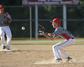 Nikos Frazier | The Vindicator..East Holmes' Patt Miller(17) opens his mitt in the second inning of the Junior Little League State Championship game at the Fields of Dreams in Boardman.