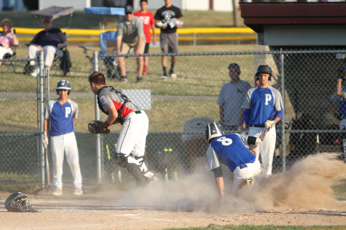 Nikos Frazier | The Vindicator..Poland's Jake Bacon(8) slides into home in the third inning during the Junior Little League State Championship game at the Fields of Dreams in Boardman.