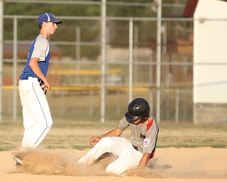 Nikos Frazier | The Vindicator..East Holmes' Kevin Borntrager(11) slides into second in the fourth inning during the Junior Little League State Championship game at the Fields of Dreams in Boardman.