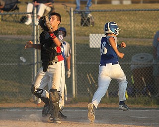 Nikos Frazier | The Vindicator..Poland's Jarrett Shorilla(48) runs into home during the Junior Little League State Championship game at the Fields of Dreams in Boardman.