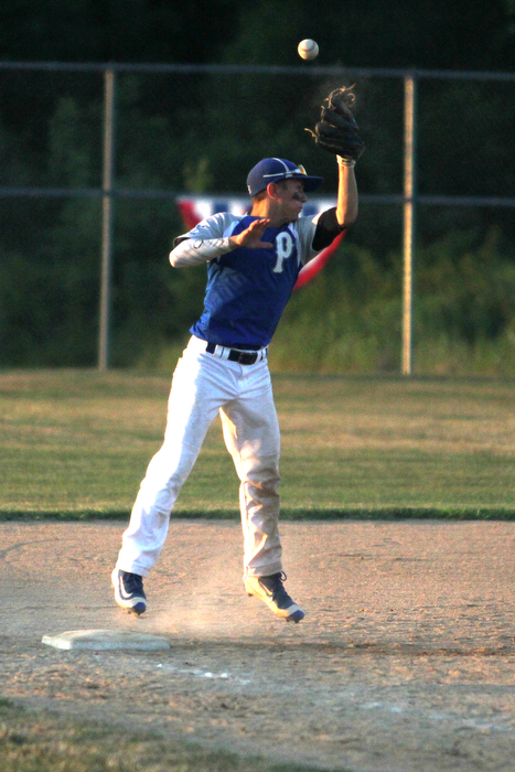 Nikos Frazier | The Vindicator..Poland's Jake Bacon(8) misses the ball in the fifth inning during the Junior Little League State Championship game at the Fields of Dreams in Boardman.