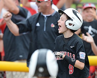 Jeff Lange | The Vindicator  THU, JUL 28, 2016 - Canfield right fielder Jameson Beck (9) celebrates as the Cardinals take the lead, 4-2, in the bottom of the third inning against Hamilton West Side at Boardman's Fields of Dreams Thursday afternoon. Canfield went on to win 11-4.