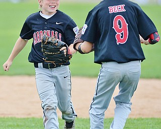 Jeff Lange | The Vindicator  THU, JUL 28, 2016 - Canfield outfielder Ty Stricko (left) celebrates with Jameson Beck after catching a fly ball to end the top of the fifth inning against Hamilton West Side Thursday afternoon at Fields of Dreams in Boardman.