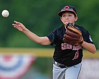 BOARDMAN, OHIO - JULY 29, 2016: Second baseman Luca Ricchiuti(13) of Canfield throws to first to force out Braylon Clinedinst(5) of Mount Vernon in the second inning of Friday evenings Little League game at the Fields of Dreams. Canfield would go on to win, 12-2.  DAVID DERMER | THE VINDICATOR