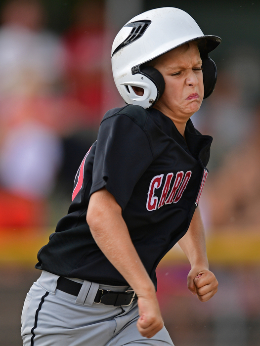 BOARDMAN, OHIO - JULY 29, 2016: Jack Davis(20) of Canfield runs to first base to attempt to reach safely in the second inning of Friday evenings Little League game at the Fields of Dreams. Canfield would go on to win, 12-2.  DAVID DERMER | THE VINDICATOR