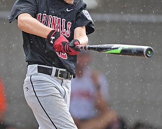 BOARDMAN, OHIO - JULY 29, 2016: Jake Schneider(12) of Canfield finishes his swing after blasting a three run home run in the fourth inning of Friday evenings Little League game at the Fields of Dreams. Canfield would go on to win, 12-2. DAVID DERMER | THE VINDICATOR