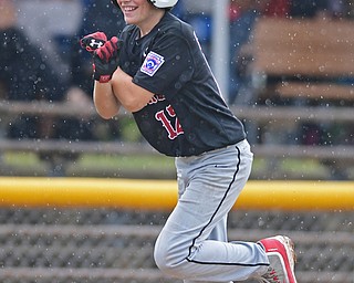 BOARDMAN, OHIO - JULY 29, 2016: Jake Schneider(12) of Canfield celebrates after blasting a three run home run in the fourth inning of Friday evenings Little League game at the Fields of Dreams. Canfield would go on to win, 12-2.  DAVID DERMER | THE VINDICATOR