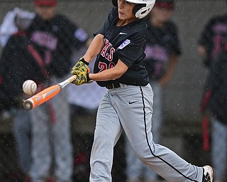 BOARDMAN, OHIO - JULY 29, 2016: Jack Davis(20) of Canfield connects with the ball and would reach on a infield single in the fourth inning of Friday evenings Little League game at the Fields of Dreams. Canfield would go on to win, 12-2. DAVID DERMER | THE VINDICATOR