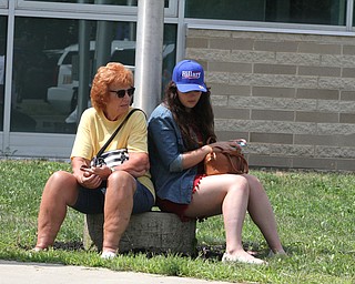 Nikos Frazier | The Vindicator..Mary Welker of Ashtabula and her grand-daughter, Gabby Brown, sit outside of East High School before Democratic Presidential candidate Hillary Clinton spoke on Saturday night.