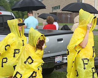 Nikos Frazier | The Vindicator..(From Left) Anita, Sharon, 10, and Rick Alcorn of Youngstown walk to the back of the line outside of East High School before Democratic Presidential candidate Hillary Clinton spoke on Saturday night.