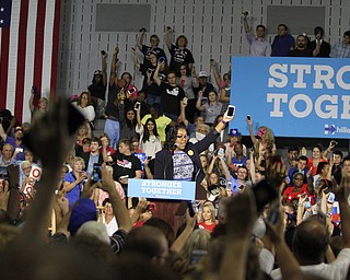 Nikos Frazier | The Vindicator..Trumbull county organizer holds her phone in the air trying to get supporters to register for text alerts..in the East High School gym before Democratic Presidential candidate Hillary Clinton spoke on Saturday night.