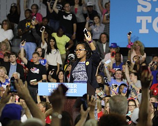 Nikos Frazier | The Vindicator..Trumbull county organizer holds her phone in the air trying to get supporters to register for text alerts..in the East High School gym before Democratic Presidential candidate Hillary Clinton spoke on Saturday night.