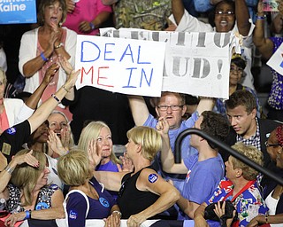 Nikos Frazier | The Vindicator..A protestor holds a "election Fraud" sign in the East High School gym before Democratic Presidential candidate Hillary Clinton spoke on Saturday night.