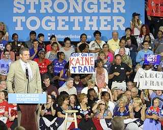 Nikos Frazier | The Vindicator..A protestor holds a "election Fraud" sign in the East High School gym before Democratic Presidential candidate Hillary Clinton spoke on Saturday night.