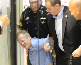 Nikos Frazier | The Vindicator..Protestor carried away by police in the East High School gym before Democratic Presidential candidate Hillary Clinton spoke on Saturday night.