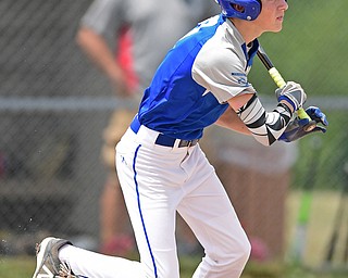 BOARDMAN, OHIO - JULY 30, 2016: Josh Blasko #7 of Poland leaves the batters box after connecting on a RBI single that would score Jarret Shurilla #48 in the second inning of the Little League Junior Division Championship game, Saturday afternoon at the Fields of Dreams. Poland won 8-4. DAVID DERMER | THE VINDICATOR