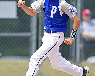 BOARDMAN, OHIO - JULY 30, 2016: Jarret Shurilla #48 of Poland pumps his fist before stepping on home plate to score a run after a RBI single by Josh Blasko #7 in the second inning of the Little League Junior Division Championship game, Saturday afternoon at the Fields of Dreams. Poland won 8-4. DAVID DERMER | THE VINDICATOR