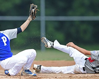 BOARDMAN, OHIO - JULY 30, 2016: Second baseman Jake Bacon #8 of Poland shows the ball to the umpire after tagging out Cordell Hershey #15 of East Holmes after he attempted to steal second base in the third inning of the Little League Junior Division Championship game, Saturday afternoon at the Fields of Dreams. Poland won 8-4. DAVID DERMER | THE VINDICATOR