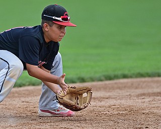 BOARDMAN, OHIO - JULY 30, 2016: Short stop Ben Slanker #14 of Canfield fields the ball before throwing to first for the out in the fourth inning of Saturday afternoons Little League game at the Fields of Dreams. Canfield won 7-2. DAVID DERMER | THE VINDICATOR