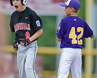 BOARDMAN, OHIO - JULY 30, 2016: Jameson Beck #9 of Canfield celebrates on second base after hitting a lead off double in the fifth inning of Saturday afternoons Little League game at the Fields of Dreams. Canfield won 7-2. DAVID DERMER | THE VINDICATOR