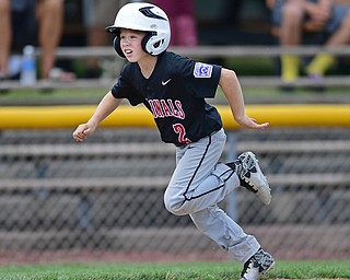BOARDMAN, OHIO - JULY 30, 2016: TY Stricko #2 of Canfield runs home to score on a double by Logan Cayavec #23 in the fifth inning of Saturday afternoons Little League game at the Fields of Dreams. Canfield won 7-2. DAVID DERMER | THE VINDICATOR