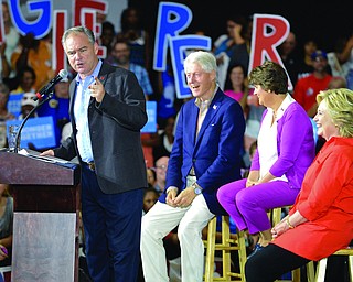 Jeff Lange | The Vindicator  SAT, JUL 30, 2016 - Vice Presidential nominee Senator Tim Kaine (left) speaks as President Bill Clinton, Kaine's wife Anne Holton and Hillary Clinton during the rally Saturday night.
