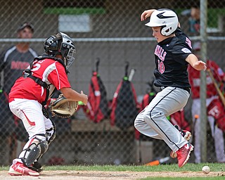 Game 1BOARDMAN, OHIO - JULY 31, 2016: Connor Miller #10 of Canfield runs home to score the winning run after catcher Matt Jones #42 of Dover misplayed the relay throw in the seventh inning of Game 1 of Sunday afternoon Little League Championship DoubleHeader. Canfield won 7-6 in 7 innings. DAVID DERMER | THE VINDICATOR